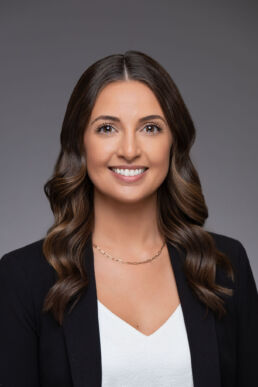 Employee headshot of female executive against gray background onsite in Tampa, Fl.