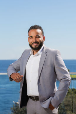 Professional branding photography, young male executive headshot onsite overlooking Tampa Bay, Florida.