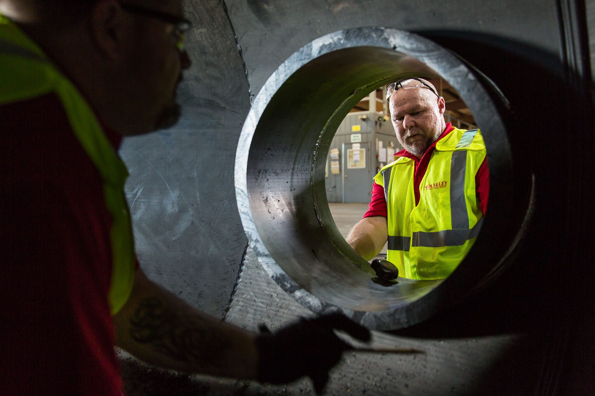 Drilling holes in large pipes at the Wolseyley Industrial Group, Industrial photography Lakeland, Florida by Tampa based commercial photographer Carver Mostardi.