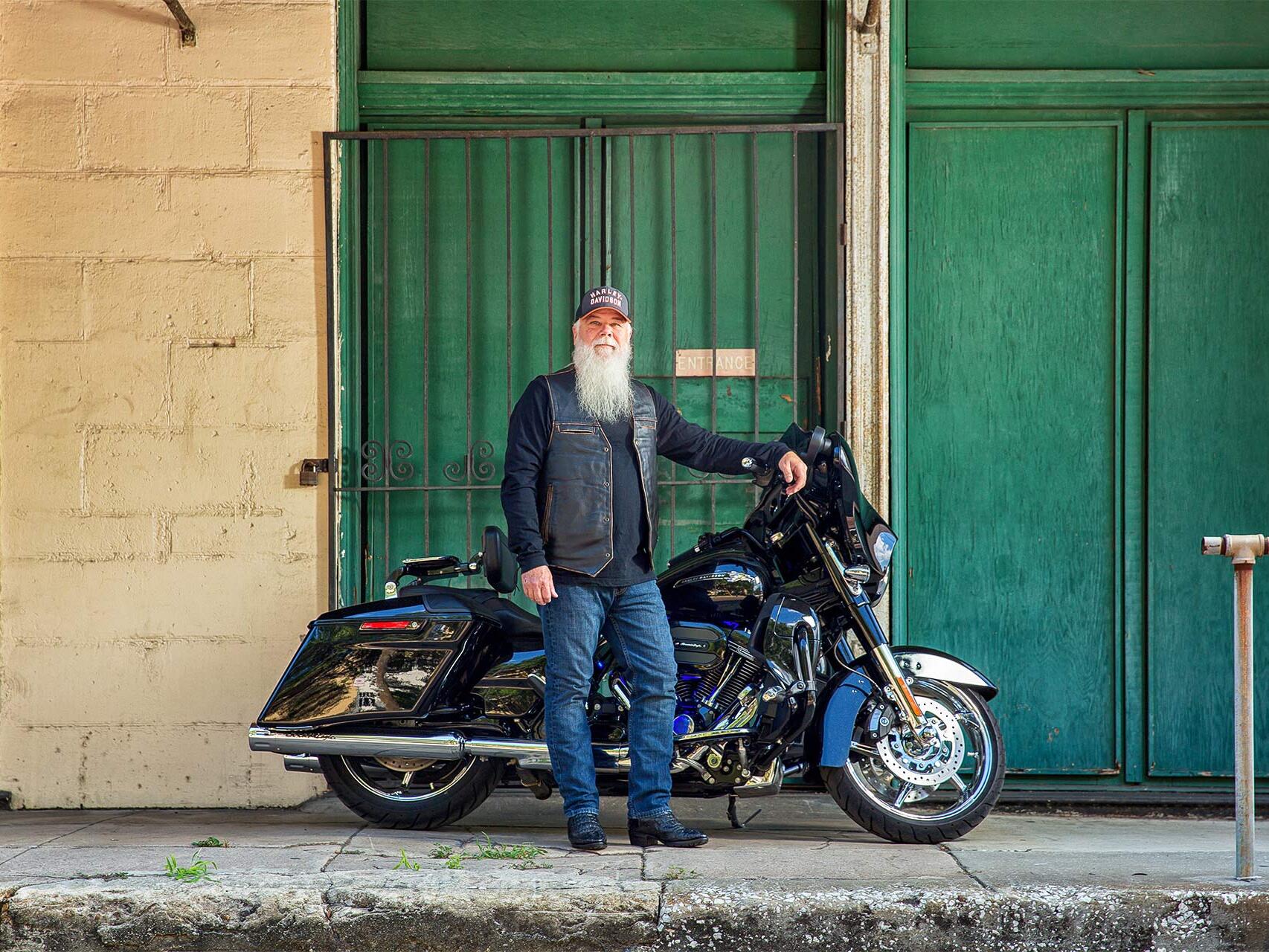 President of Kingdom First Holding, Kent Davis, with motorcycle in Ybor City by Tampa commercial photographer Carver Mostardi.