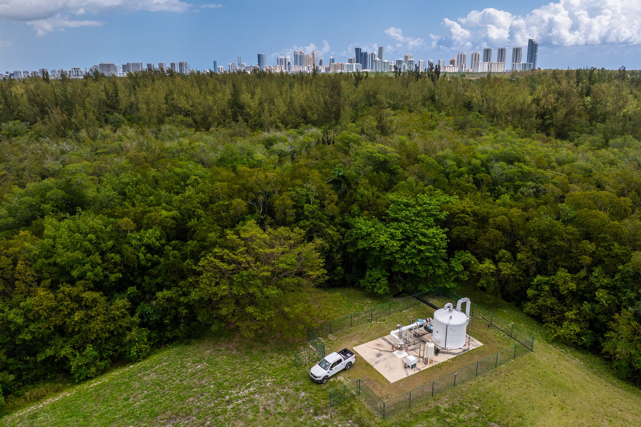 Aerial industrial photo of a remote utility facility surrounded by Florida landscape.