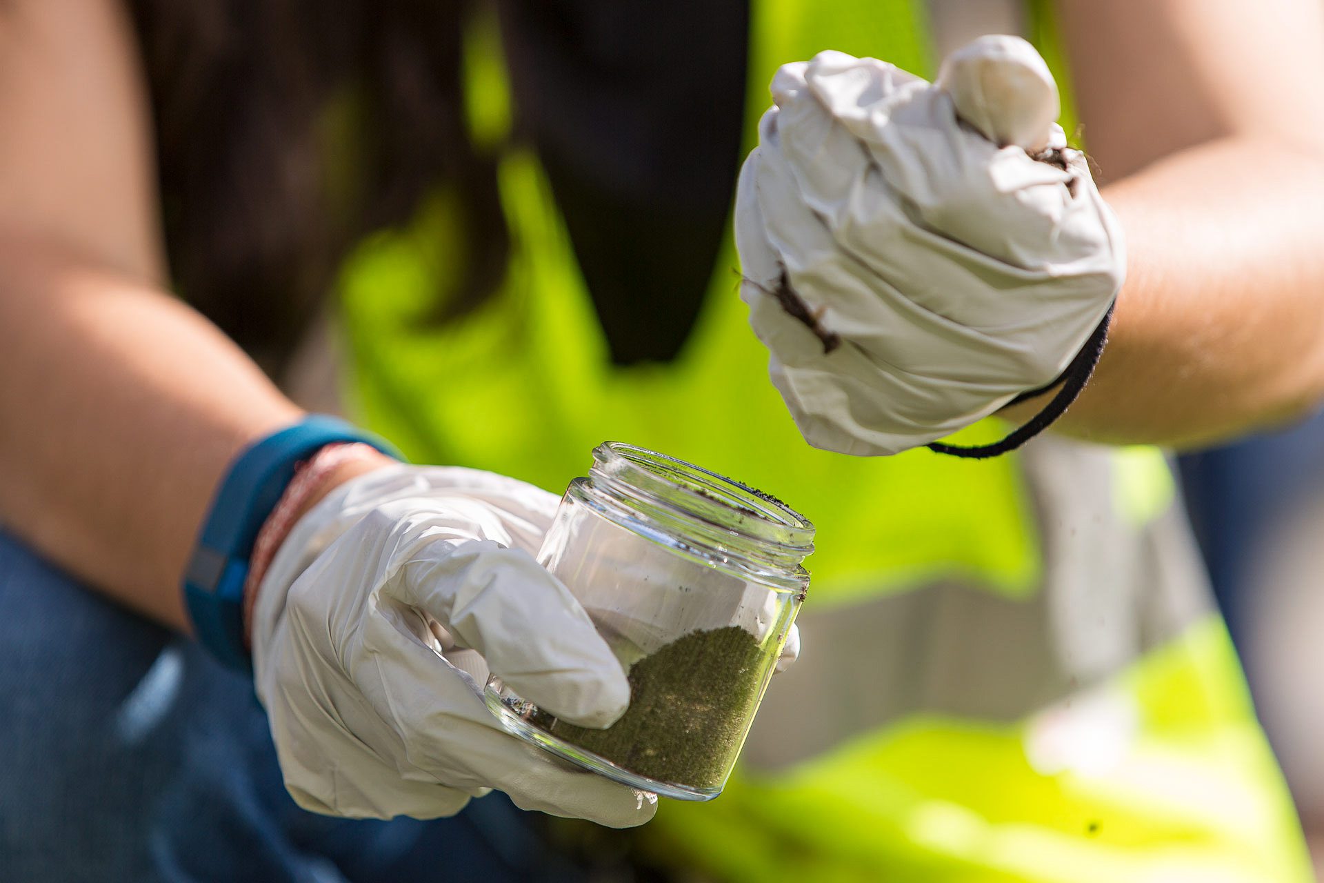 Industrial photography of a field technician conducting safety inspection on-site.
