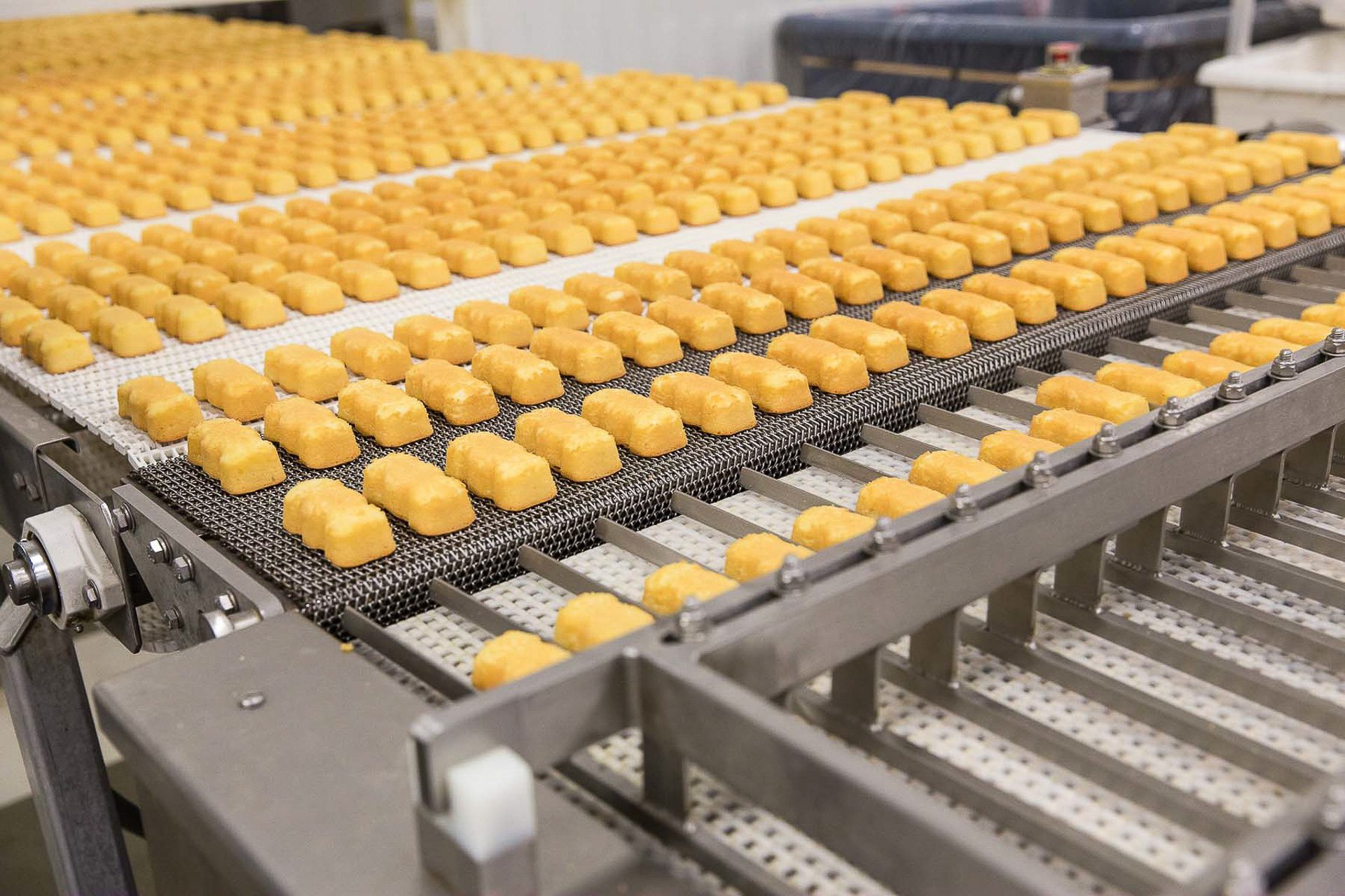 Industrial photo of automated bakery production line.