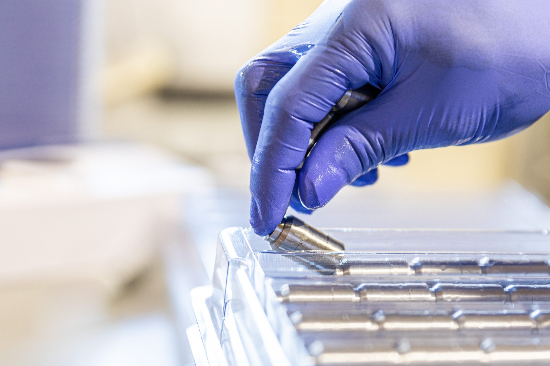 Clean room photography of a technician assembling components in Orlando, FL.