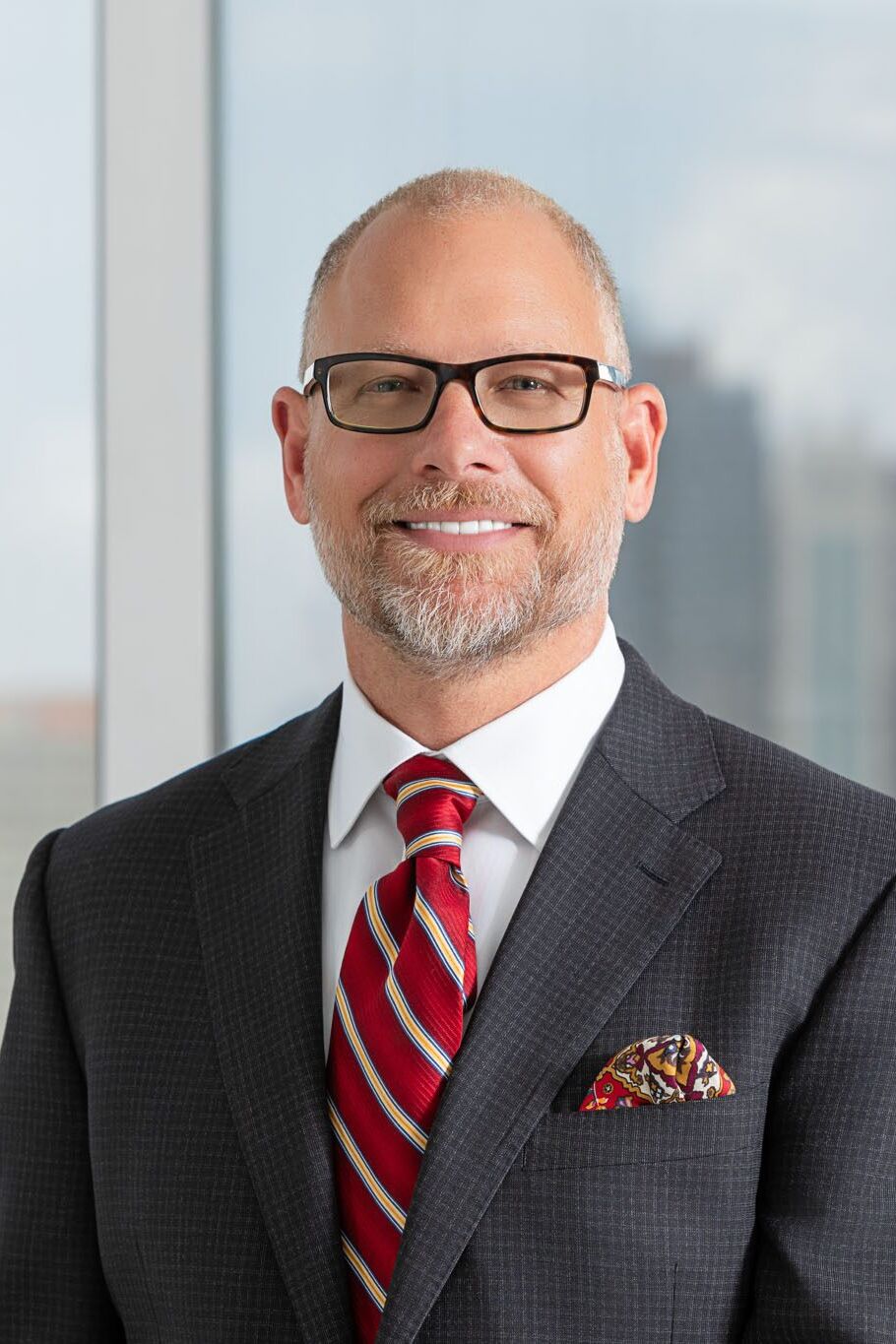 Tampa corporate photographer capturing professional attorney portrait in modern business office setting.
