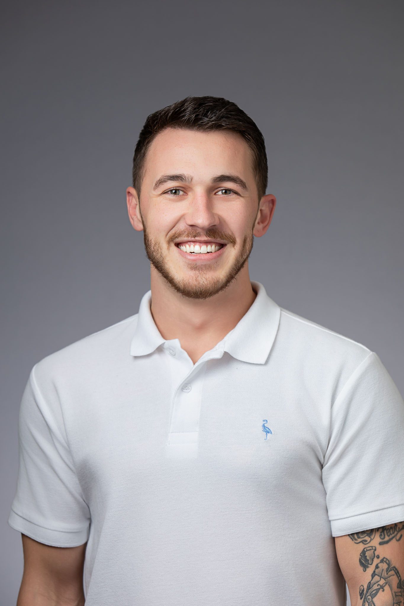 Professional Tampa employee headshot photographed in office studio by corporate photographer for website use.