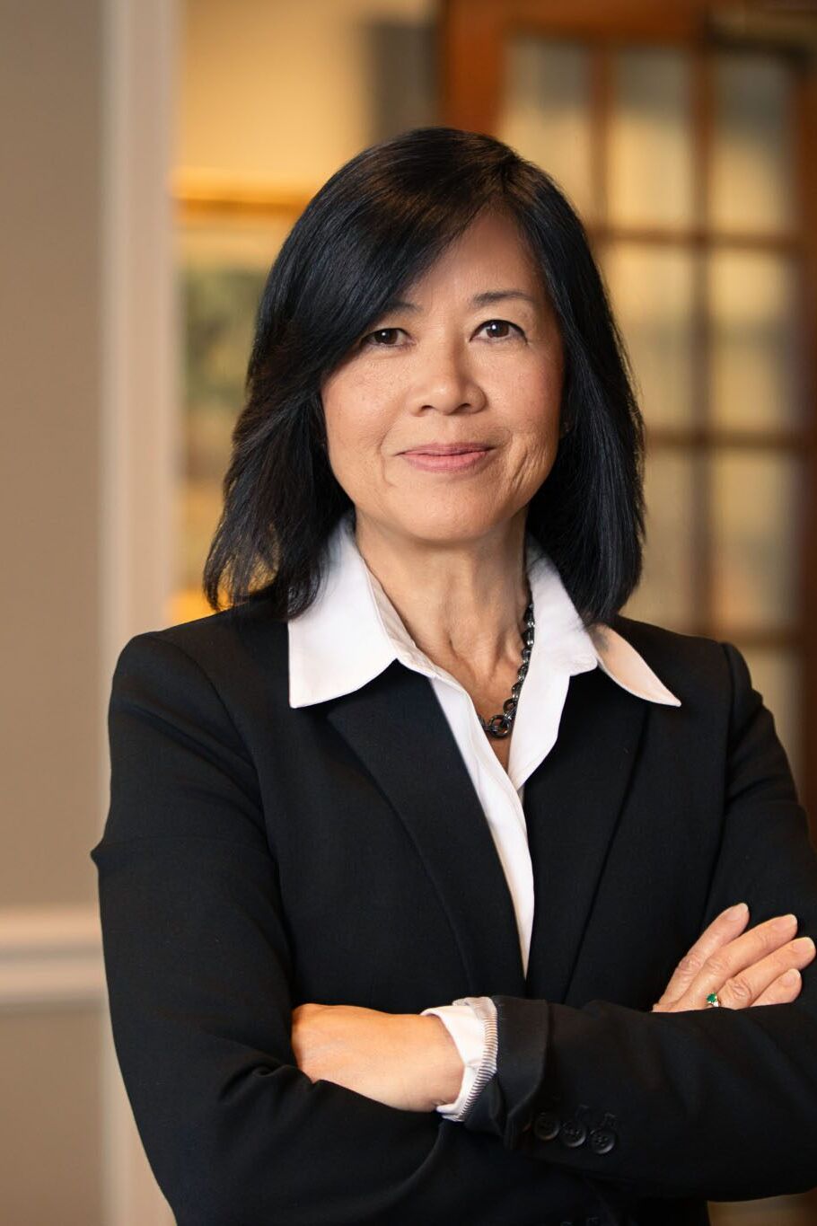 Tampa corporate photographer capturing executive portrait of businesswoman in modern office environment.