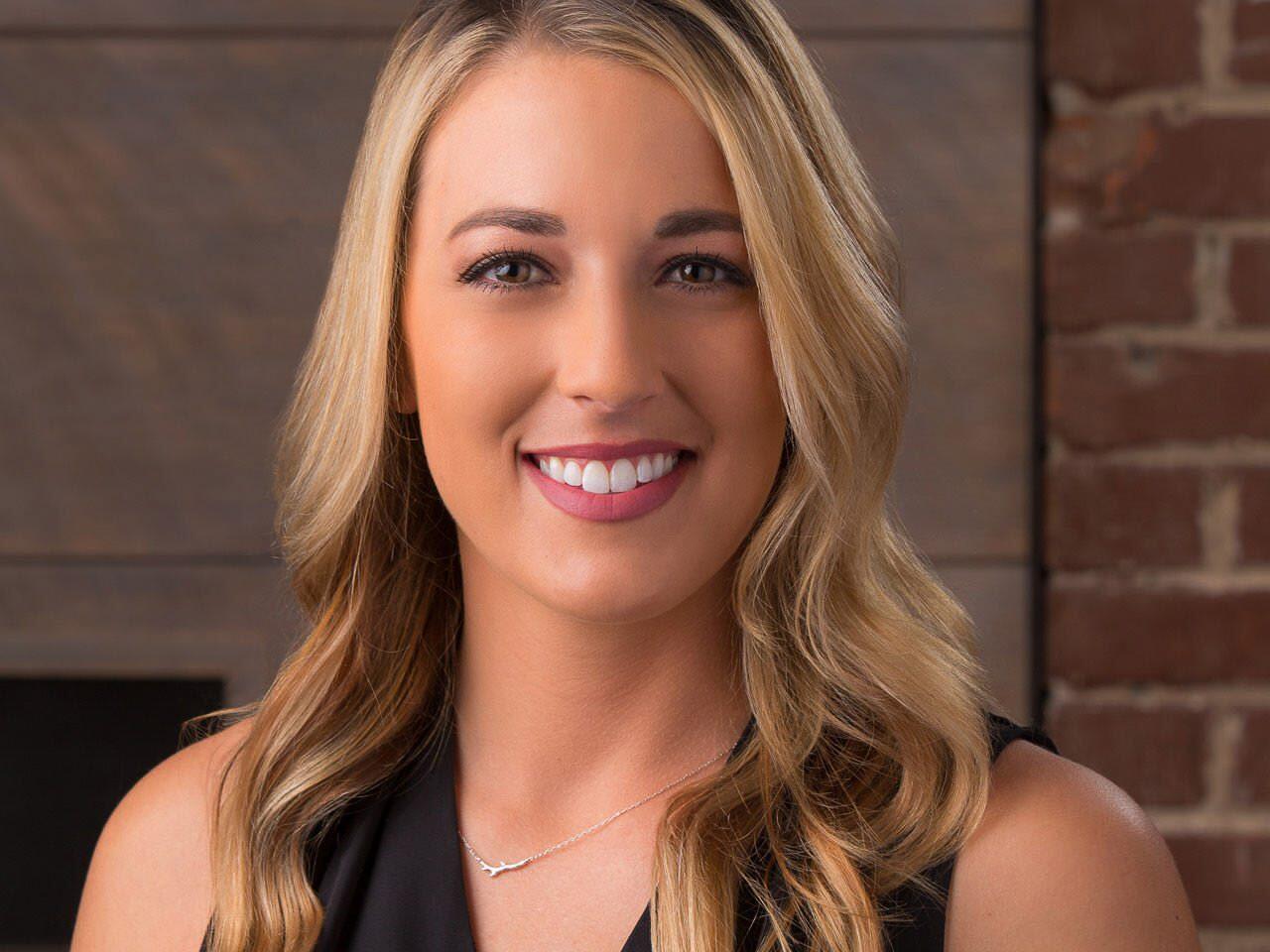 Professional headshot of employee with rustic background - business portrait photography Tampa Bay.