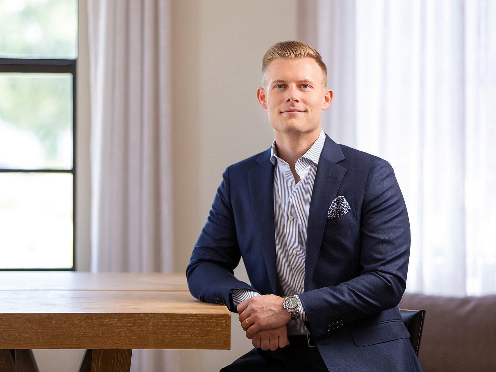 Professional headshot of young male executive photographed in downtown Tampa, Florida.