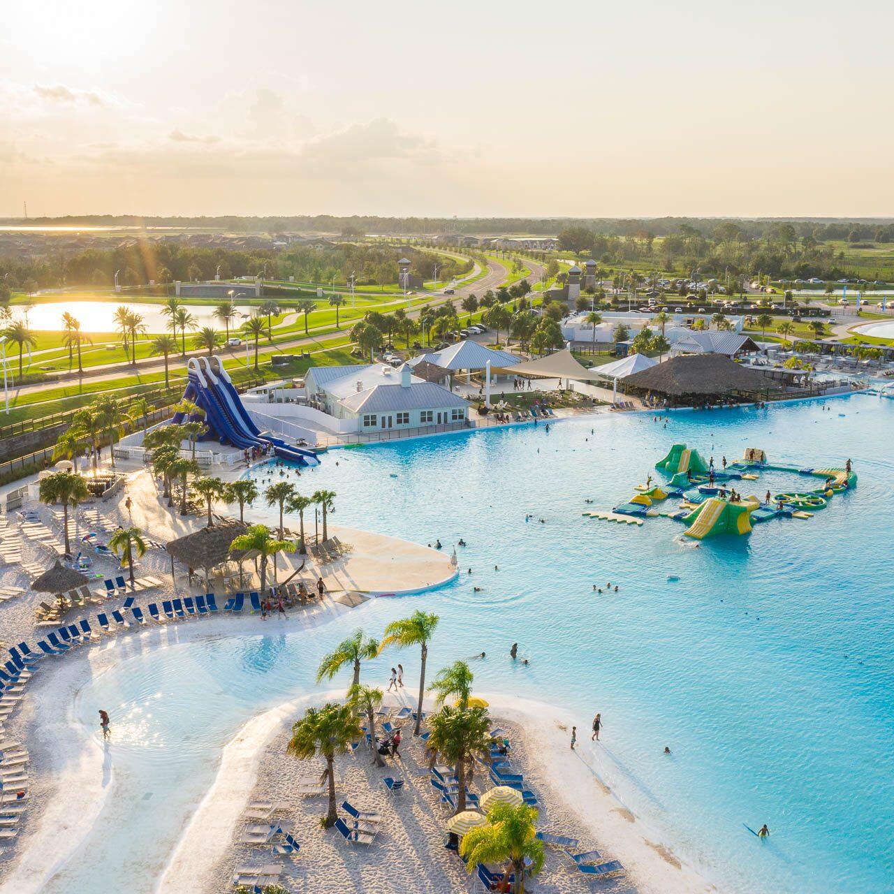 Aerial drone photograph of Epperson Lagoon water park and surrounding community at sunset near Tampa, Florida.