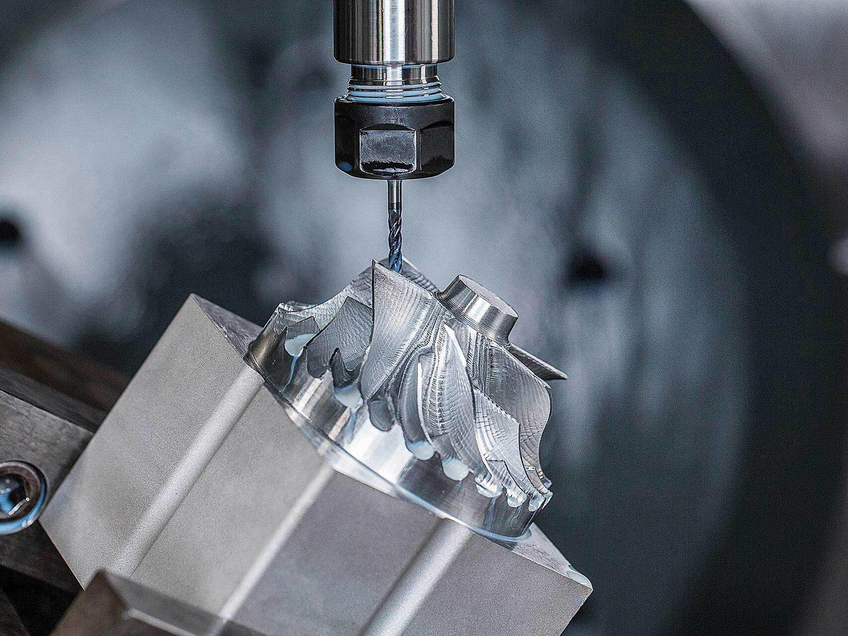 CNC machine milling metal gear - industrial photography by Tampa commercial photographer.